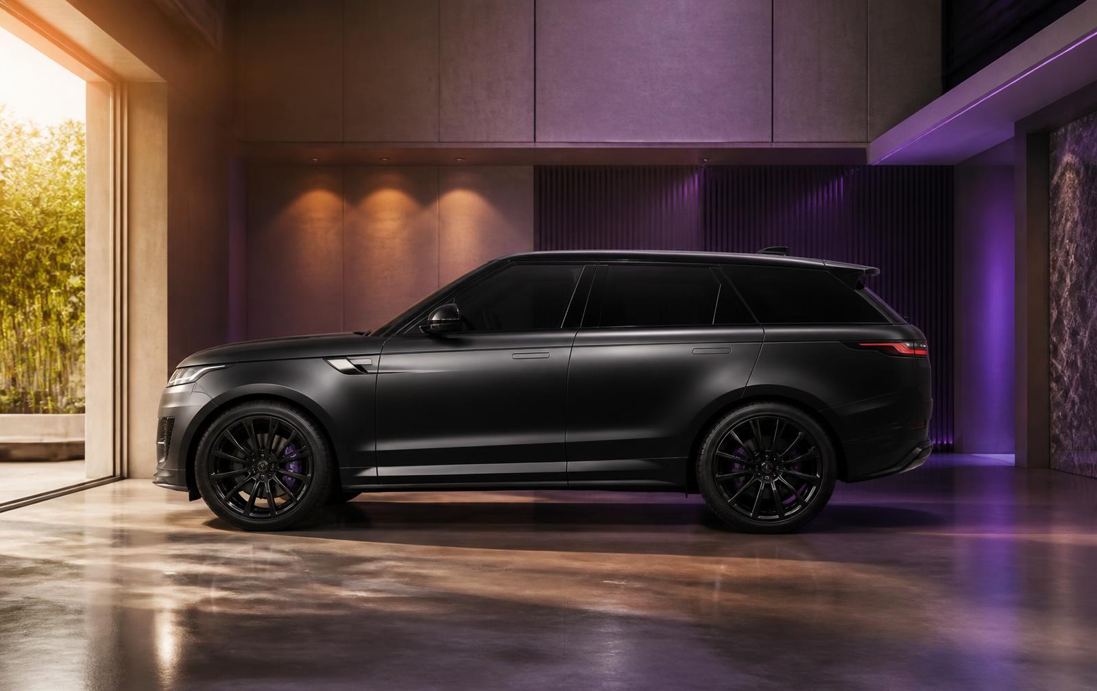 Luxury matte black SUV parked in a sunlit modern garage